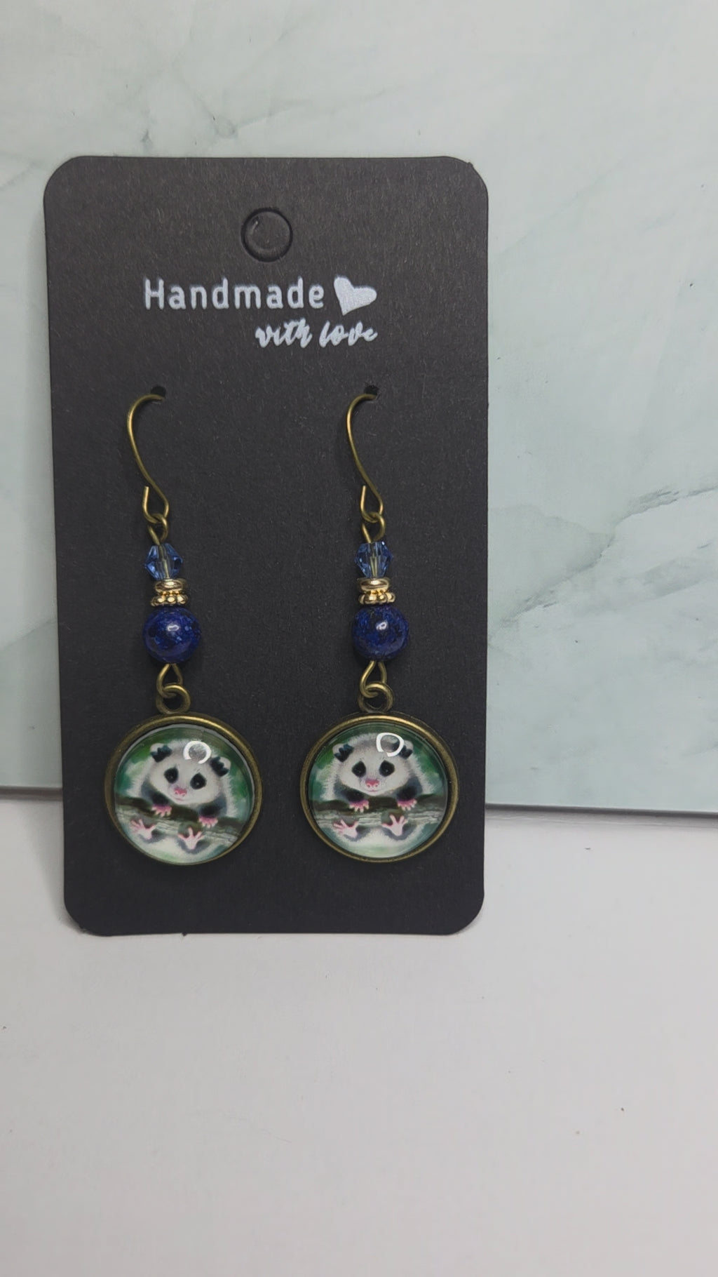 Opossum drop earrings with beads