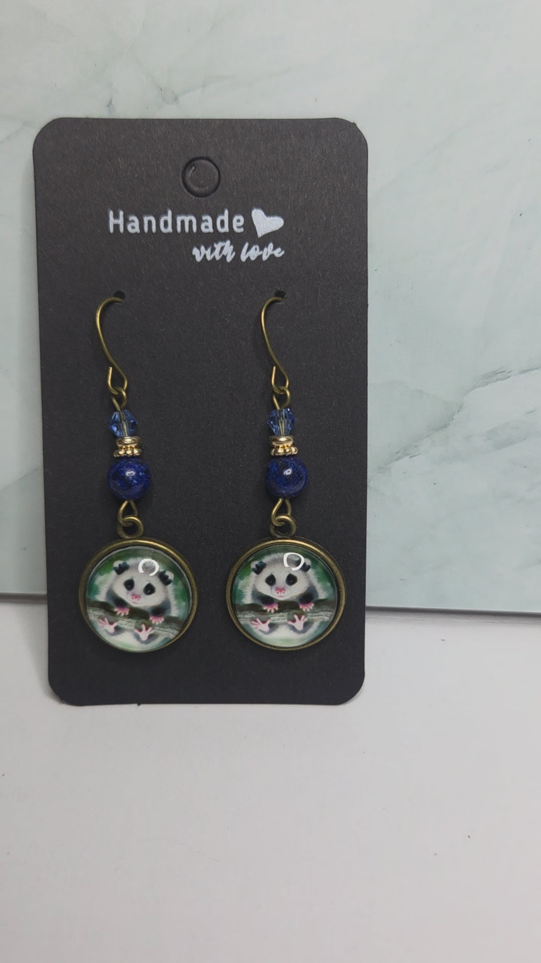 Opossum drop earrings with beads